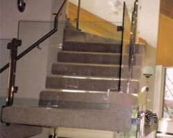 Here's an example of a more contemporary look at a glass railing. It almost looks nonexistent. Here's an example of a more contemporary look at a glass railing. It almost looks nonexistent.