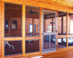 All storms and screens are generally repairable, if not we are here at Charlevoix Glass to build you a new one. We also do full screen porches with storm options to the full custom enclosures as pictured above