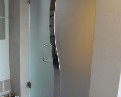 One of our many shower door displays: 3/8" Steam Mist "S" shaped door & panel. Supported by clamps and hinges. Representing one of the many European looks One of our many shower door displays: 3/8" Steam Mist "S" shaped door & panel. Supported by clamps and hinges. Representing one of the many European looks