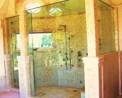 Charlevoix Glass is your custom design shower company, 1/2″ clear tempered frameless shower door with movable transom, and 5 panels built into the tile complete with glass top to keep steam in Charlevoix Glass is your custom design shower company, 1/2″ clear tempered frameless shower door with movable transom, and 5 panels built into the tile complete with glass top to keep steam in